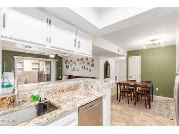 Modern kitchen with granite countertops and stainless steel appliances at 540 N May St # 1145, Mesa, AZ 85201