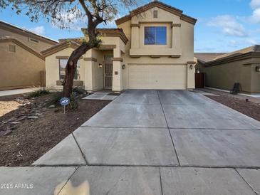 Two-story house with attached garage and landscaped front yard at 11325 W Hazelwood St, Phoenix, AZ 85037