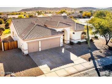 Aerial view of a single-story house with a three-car garage at 17765 W Summit Dr, Goodyear, AZ 85338