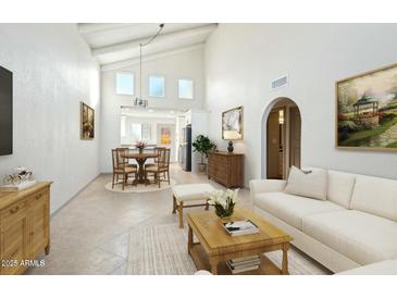 Bright living room with vaulted ceilings and hardwood floors at 2227 E Catalina Dr, Phoenix, AZ 85016
