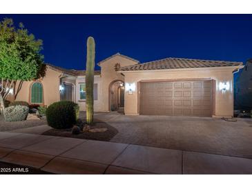 Single-story home with desert landscaping and a two-car garage at 26398 W Cat Balue Dr, Buckeye, AZ 85396