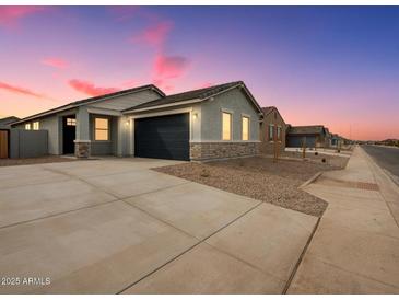 Charming single-story home with a two-car garage and stone accents on the facade at 2685 E Santa Ynez Dr, Casa Grande, AZ 85194