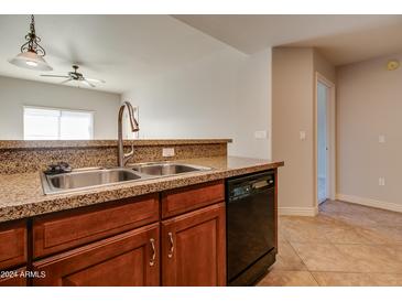 Modern kitchen with granite countertops and stainless steel appliances at 5450 E Deer Valley Dr # 4201, Phoenix, AZ 85054