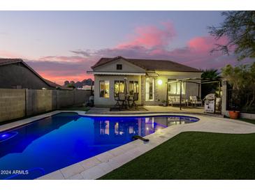 Stunning backyard oasis with a sparkling pool at 10283 E Fortuna Ave, Gold Canyon, AZ 85118