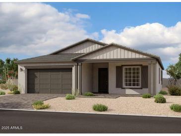 Single-story home with gray siding, dark garage door, and landscaping at 11457 E Utopia Ave, Mesa, AZ 85212