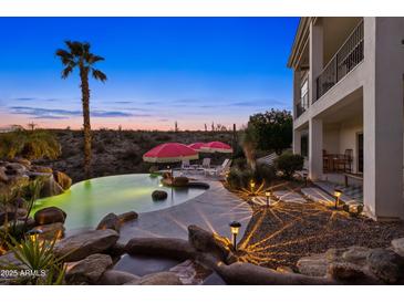 Luxury pool with waterfall feature and spacious patio area at 13231 N El Pueblo Blvd, Fountain Hills, AZ 85268