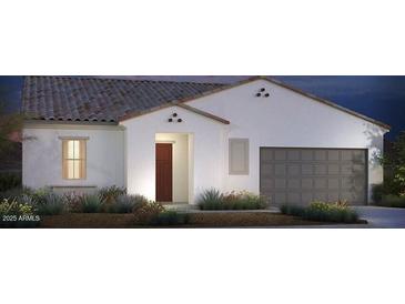 Single-story home with a two-car garage and desert landscaping at 18104 W Silverwood Dr, Goodyear, AZ 85338