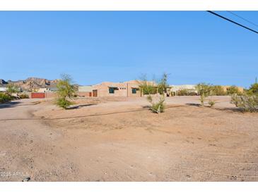 Single-story home with stucco exterior, desert landscaping, and mountain views at 274 E Mckellips Blvd, Apache Junction, AZ 85119