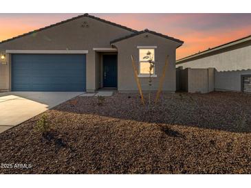 Charming single-story home featuring a well-maintained yard, blue garage door, and desert landscaping at 3403 E Audrey Dr, San Tan Valley, AZ 85143