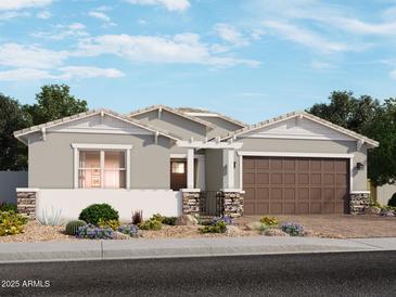 One-story home with brown garage door and stone accents at 4727 N 177Th Dr, Goodyear, AZ 85395