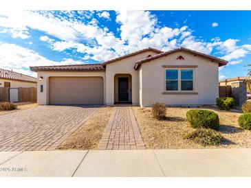 Single-story home with attached garage and landscaped front yard at 4806 S 110Th Ave, Tolleson, AZ 85353