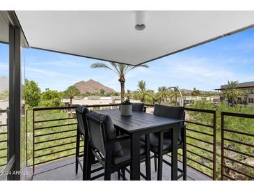 Spacious balcony with mountain views and seating for four at 7117 E Rancho Vista Dr # 4005, Scottsdale, AZ 85251