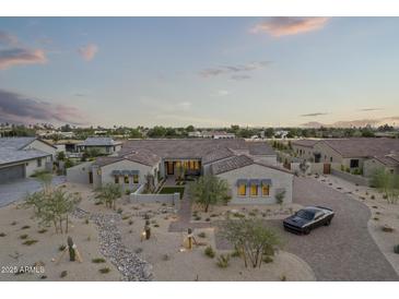 Luxury home with desert landscaping, pool, and expansive views at 12347 E Gold Dust Ave, Scottsdale, AZ 85259