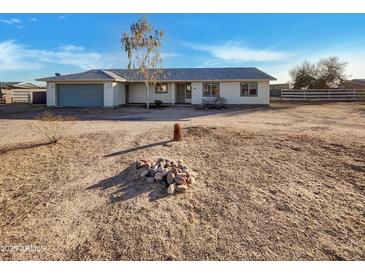 Newly constructed single-story home with a neutral color palette and spacious yard at 31027 W Bellview St, Buckeye, AZ 85396