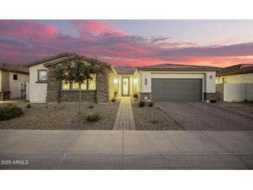 Beautiful one-story home with stone accents and a landscaped front yard at 39725 N Hailey Ln, San Tan Valley, AZ 85140