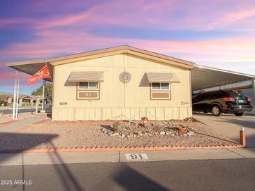 Single-wide manufactured home with carport at 8600 E Broadway Ave # 91, Mesa, AZ 85207