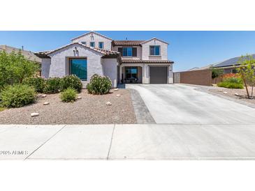 Two-story house with a two-car garage and nicely landscaped front yard at 19690 W Marshall Ave, Litchfield Park, AZ 85340