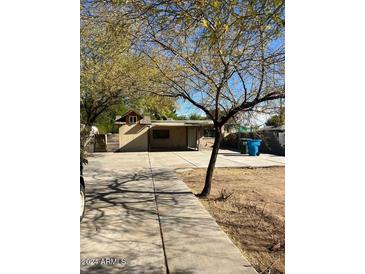 Ranch style home with large driveway and mature trees at 2029 N 22Nd Pl, Phoenix, AZ 85006