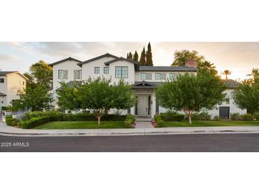 Stunning two-story home with landscaping and a welcoming front entrance at 3370 N 55Th Pl, Phoenix, AZ 85018