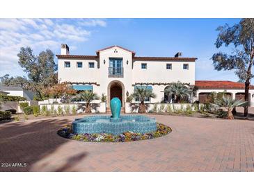 Stunning Spanish-style home with a circular driveway and manicured landscaping at 4417 N Camino Allenada --, Phoenix, AZ 85018