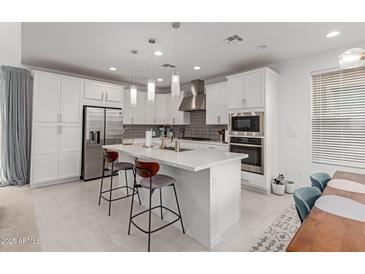 Spacious kitchen featuring white cabinets and a large island at 1685 S Wallrade Ln, Gilbert, AZ 85295