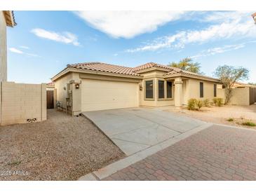 Single-story home with attached garage and desert landscaping at 2298 E Hazeltine Way, Chandler, AZ 85249