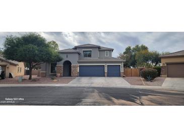 Two-story home with a two-car garage and landscaped front yard at 2463 W Morning Sun Cir, San Tan Valley, AZ 85144