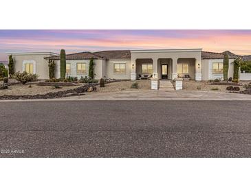 Stunning desert contemporary home with landscaped front yard at 34083 N Paseo Grande Dr, Queen Creek, AZ 85144