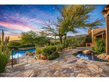 Stunning backyard with a pool, spa, and mountain views at 39863 N 105Th Pl, Scottsdale, AZ 85262