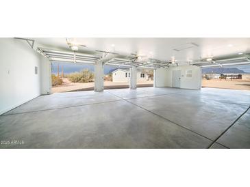 Spacious three-car garage with high ceilings and open view at 5089 E 26Th Ave, Apache Junction, AZ 85119