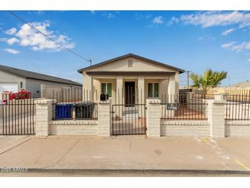 Newly renovated craftsman home with a fenced front yard at 562 N Lewis --, Mesa, AZ 85201