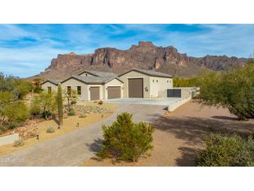 Stunning desert home with mountain views, 3-car garage, and paved driveway at 605 N Star Ct, Apache Junction, AZ 85119