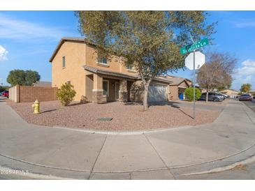 Two-story house with a landscaped yard and two-car garage at 7504 S Sundown Ct, Buckeye, AZ 85326