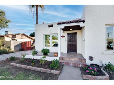 Charming Spanish style home with landscaped front yard at 903 W Mackenzie Dr, Phoenix, AZ 85013