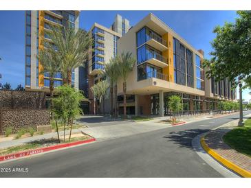 Modern multi-story building with palm trees and city views at 200 W Portland St # 817, Phoenix, AZ 85003