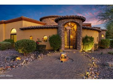 Stunning upscale home with stone accents and wrought iron gates at 3257 N Piedra Cir, Mesa, AZ 85207