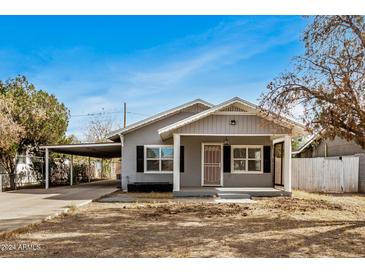 Cute bungalow home with a carport and front yard at 4033 N 14Th Pl, Phoenix, AZ 85014