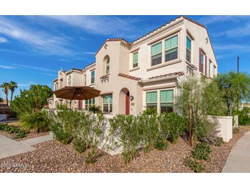 Two-story stucco home with patio, landscaping, and attractive curb appeal at 4077 S Sabrina Dr # 24, Chandler, AZ 85248