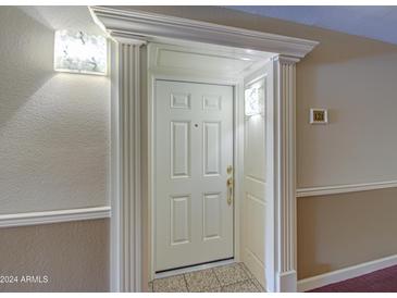 Elegant entryway with ornate trim and light fixtures at 4200 N Miller Rd # 121, Scottsdale, AZ 85251