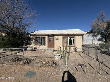 Ranch style home with front yard and chain link fence at 140 W 8Th Ave, Mesa, AZ 85210