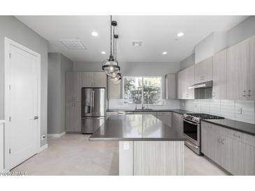 Modern kitchen with stainless steel appliances at 1717 E Morten Ave # 23, Phoenix, AZ 85020