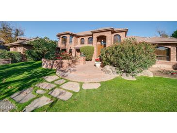 Brick house with landscaped yard and stone pathway at 8280 S Pecan Grove Cir, Tempe, AZ 85284