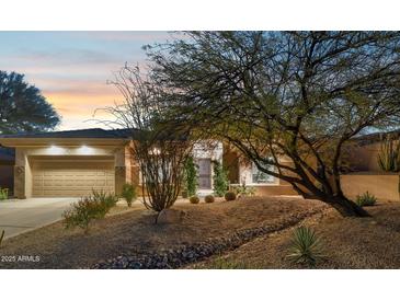 Single-story home with desert landscaping and a two-car garage at 14501 N Lark Ct, Fountain Hills, AZ 85268