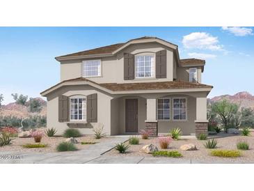 Two-story house with brown roof and light beige walls, landscaping, and walkway at 14652 W Sand Hills Rd, Surprise, AZ 85387