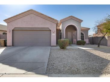 Single-story home with a two-car garage and desert landscaping at 18473 W Piedmont Rd, Goodyear, AZ 85338