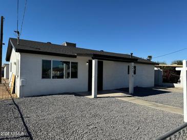 Newly renovated single story home with a gravel front yard at 236 S 2Nd St, Avondale, AZ 85323