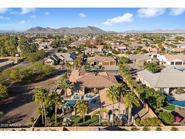 Luxury home with pool and mountain views in a residential neighborhood at 8429 W Sands Ct, Peoria, AZ 85383