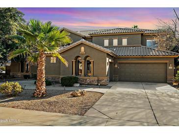 Two-story house with a tile roof, and a three-car garage at 2205 E Taurus Pl, Chandler, AZ 85249