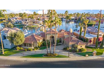 Luxury home on the lake with a private boat dock and beautiful landscaping at 10489 N 99Th St, Scottsdale, AZ 85258