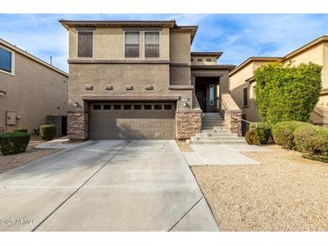 Two-story house with attached garage and landscaping at 1270 E Marcella Ln, Gilbert, AZ 85295